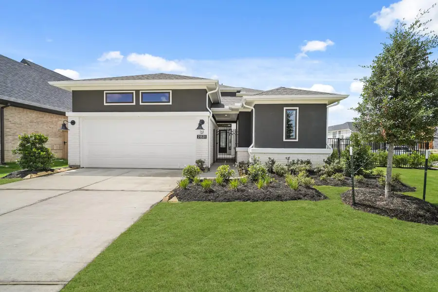 Front exterior of a new home in Bridgeland 45', 50', 70', Cypress, TX, highlighting curb appeal (Image 1).
