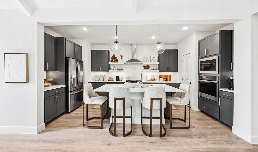 Kitchen with vast island & pendant lights