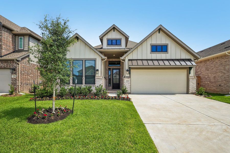 Front exterior of a new home in Wood Leaf Reserve, Tomball, TX, highlighting curb appeal (Image 1). Front exterior of a new home in Wood Leaf Reserve, Tomball, TX, highlighting curb appeal (Image 1).