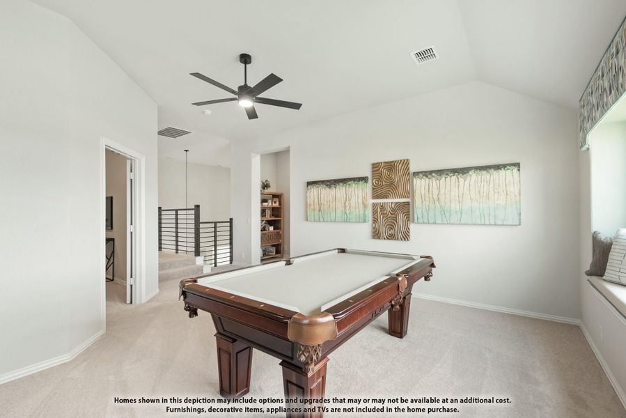 Game room with pool table, vaulted ceiling, ceiling fan, and carpet flooring on upper level Game room with pool table, vaulted ceiling, ceiling fan, and carpet flooring on upper level