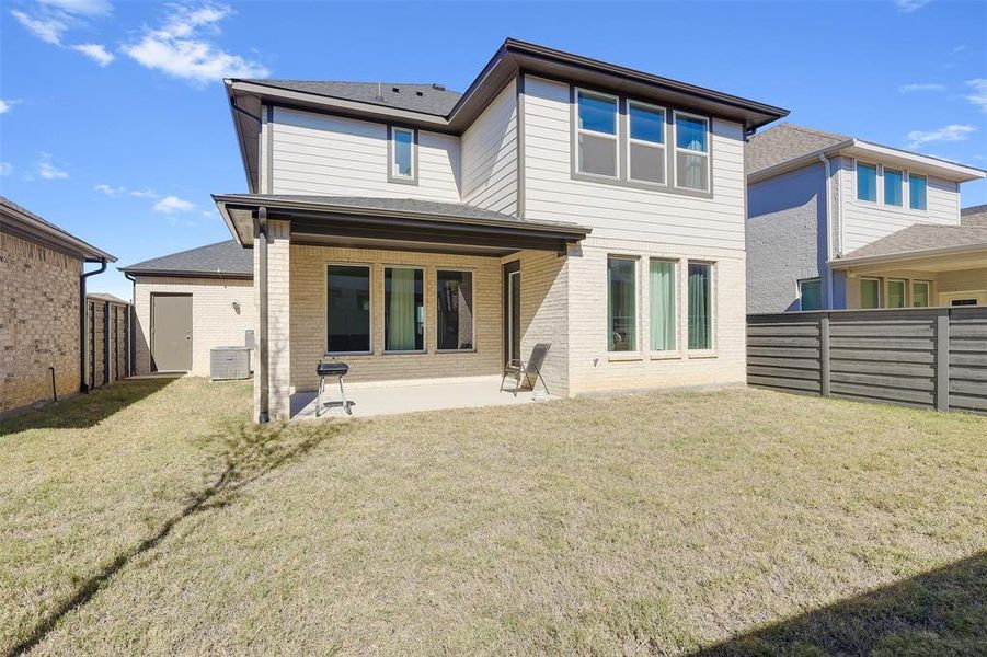 Exterior details and patio area of a home in Garden Collection at Union Park, Little Elm (Image 25).