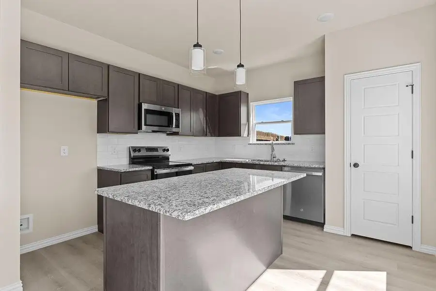 Furnished interior view inside a new home in Trails of Fossil Creek, Fort Worth (Image 5).