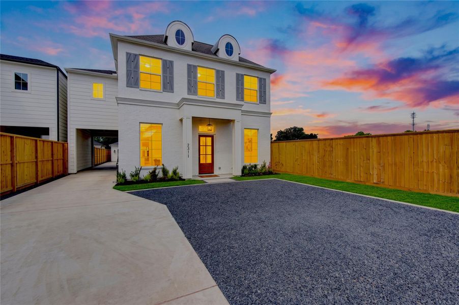 Beautiful exterior view of 2311 Hollister showcasing the home’s modern architectural design, striking curb appeal, and expansive gated private parking area. The contemporary façade is enhanced by warm exterior lighting, creating an impressive welcome from the moment you arrive. Beautiful exterior view of 2311 Hollister showcasing the home’s modern architectural design, striking curb appeal, and expansive gated private parking area. The contemporary façade is enhanced by warm exterior lighting, creating an impressive welcome from the moment you arrive.