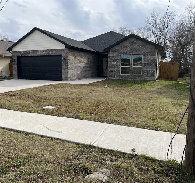 Front exterior of a new home in , Greenville, TX, highlighting curb appeal (Image 19).