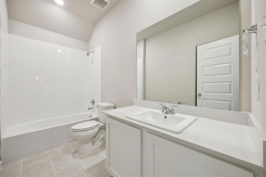 Bathroom in the Oscar home plan by Trophy Signature Homes – REPRESENTATIVE PHOTO