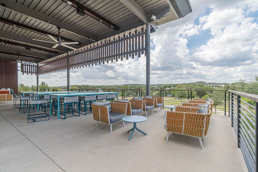 An inviting outdoor terrace offers both dining and lounge areas, providing scenic views and comfort. An inviting outdoor terrace offers both dining and lounge areas, providing scenic views and comfort.