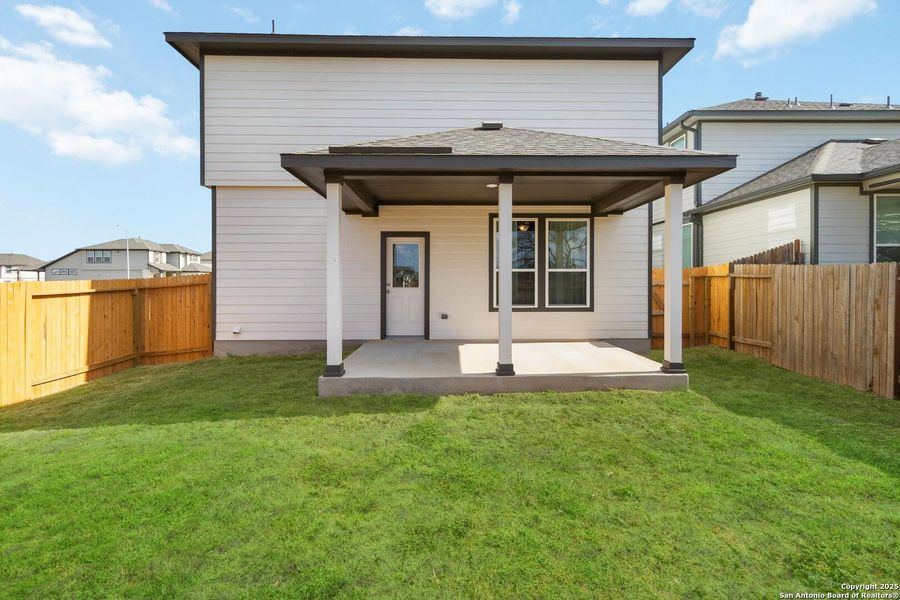 Exterior details and patio area of a home in Hickory Ridge, Elmendorf (Image 3).