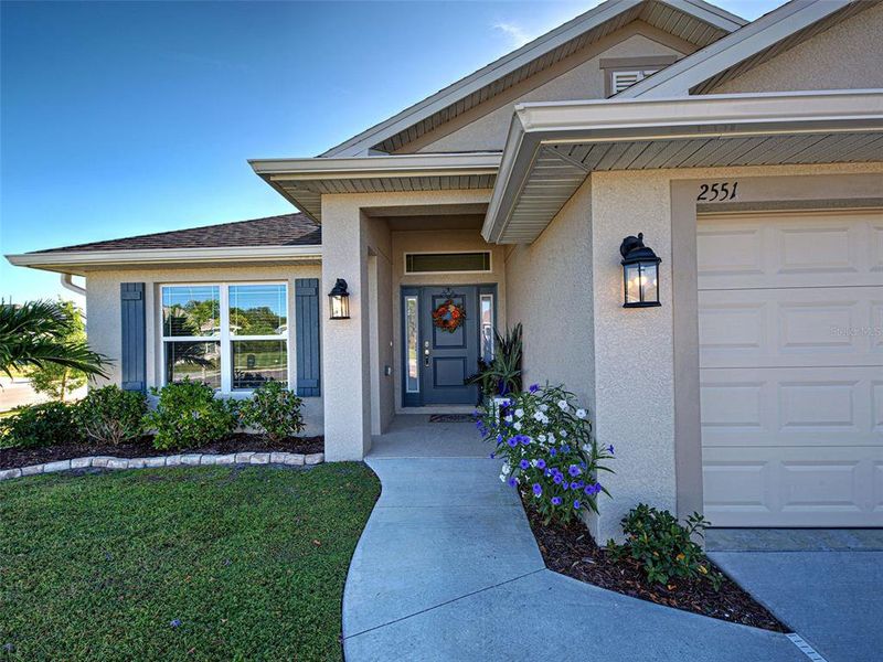 Exterior details and patio area of a home in Watercress Cove, North Port (Image 25).