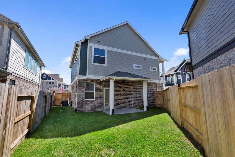 Exterior details and patio area of a home in Balmoral, Humble (Image 4).