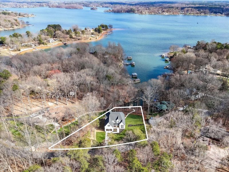 Aerial view highlighting the property boundaries and private wooded lot just moments from the shores of Lake Norman.