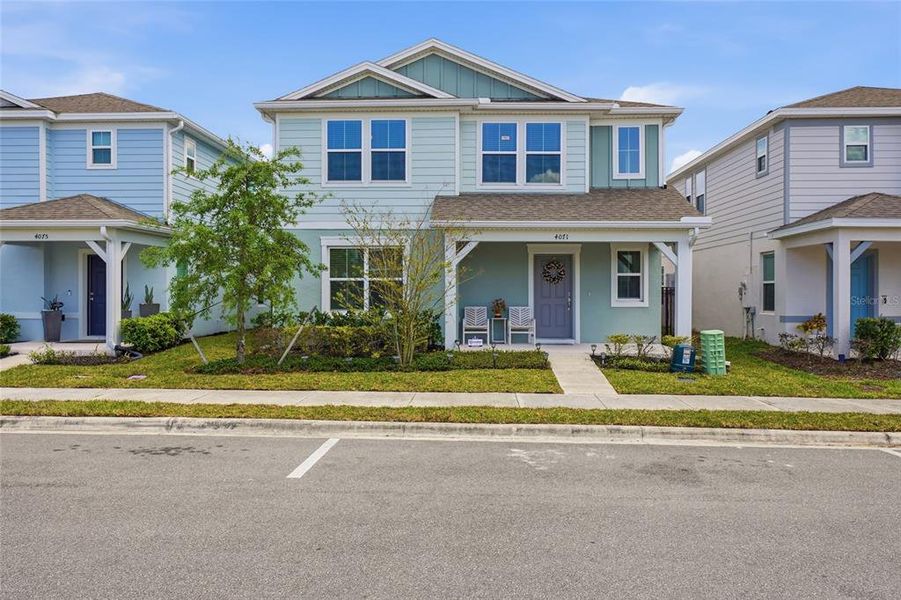 Front exterior of a new home in Winding Meadows, Apopka, FL, highlighting curb appeal (Image 29).