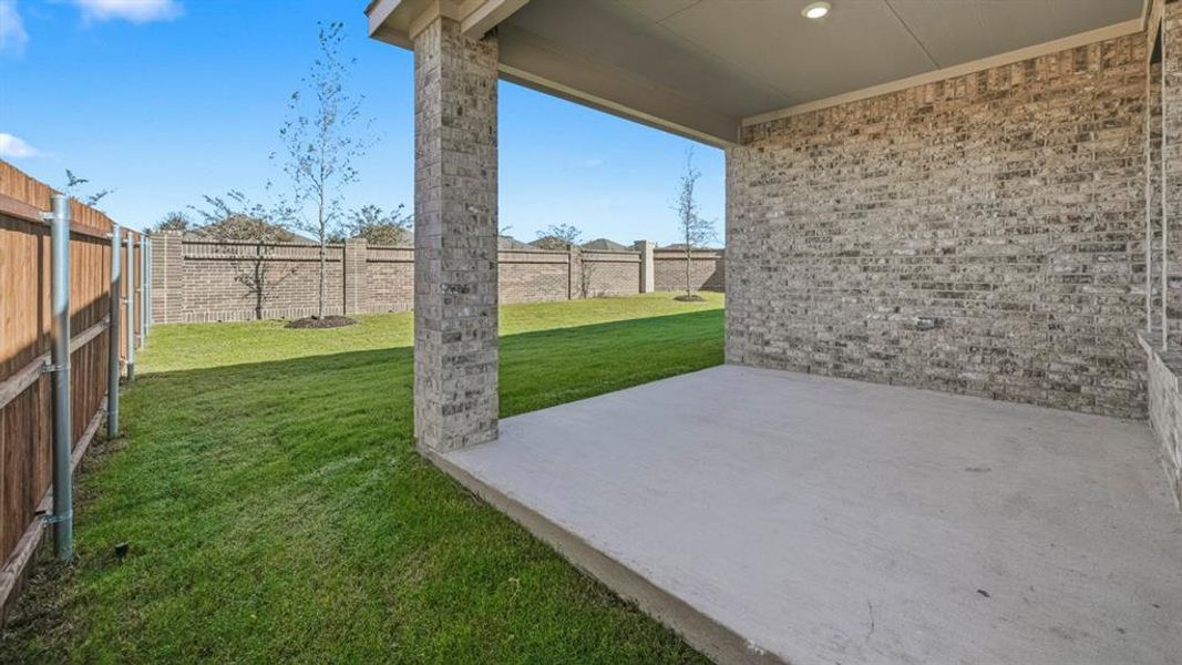 Fenced backyard featuring a patio Fenced backyard featuring a patio