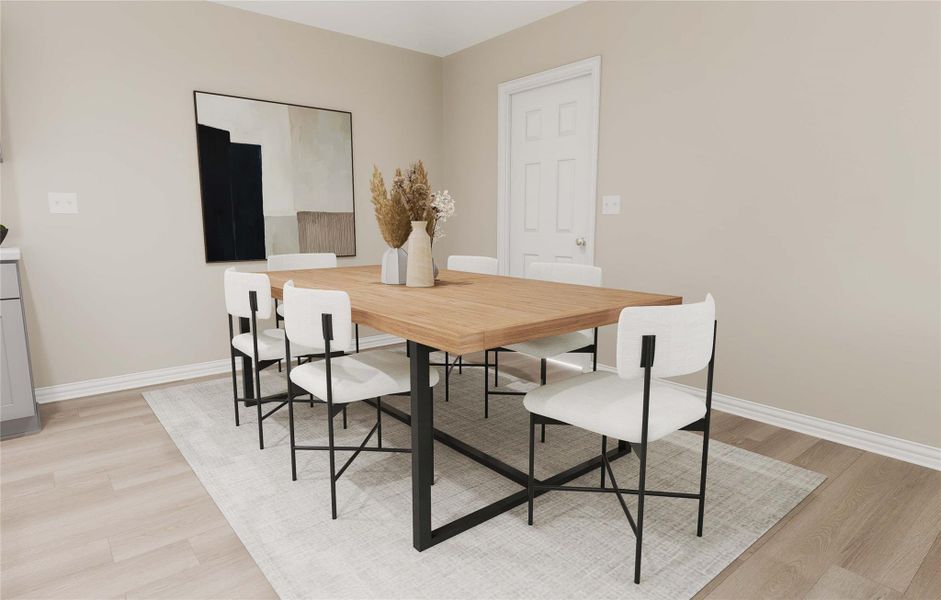 Dining space featuring light wood-style floors and baseboards