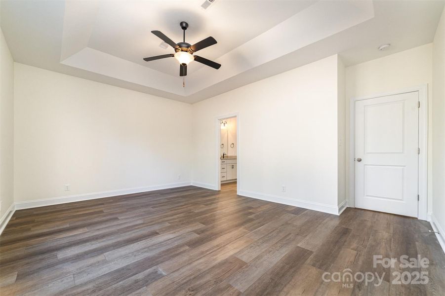 Primary bedroom with tray ceiling