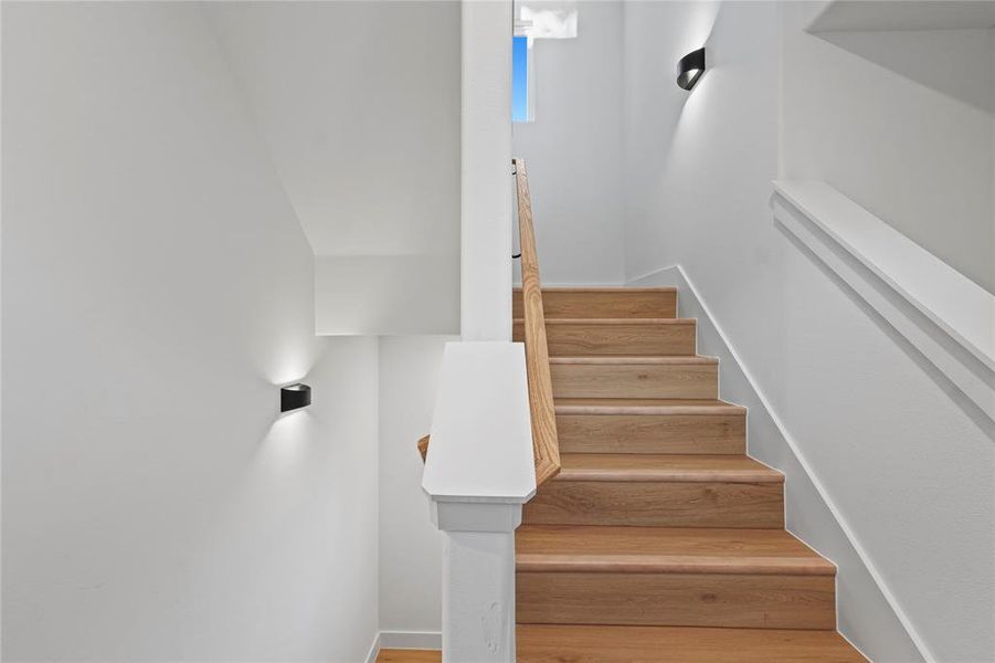 Staircase with hardwood / wood-style floors