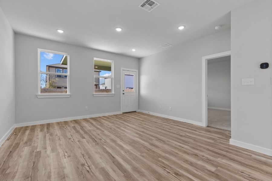 A room with a wood floor and a wood floor.