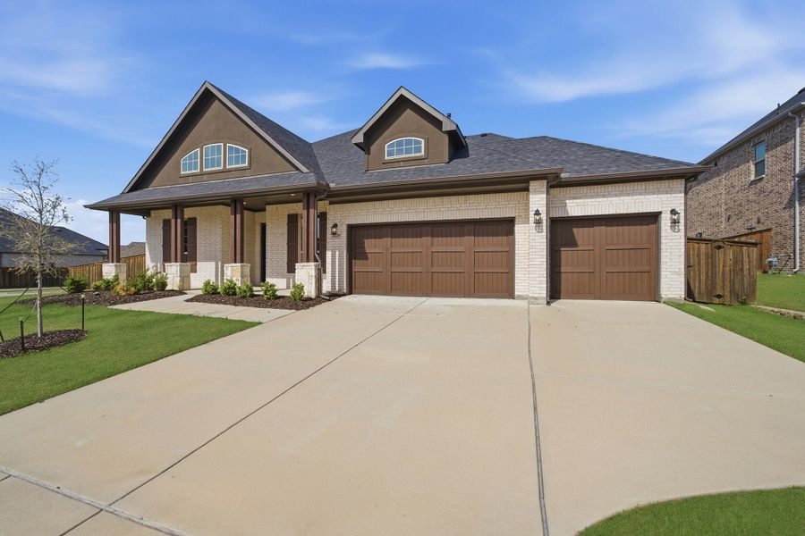 Front exterior of a new home in Sonoma Verde, Heath, TX, highlighting curb appeal (Image 2).