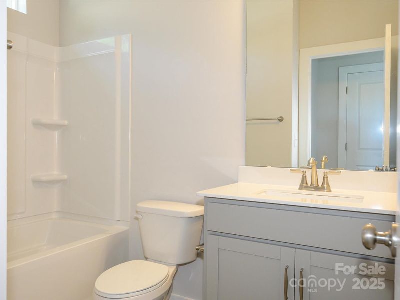 Furnished interior view inside a new home in Central Living at Craig, Charlotte (Image 9).