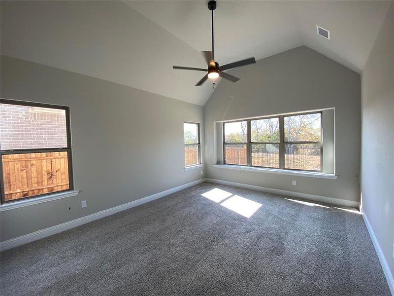 Master bedroom with vaulted ceilings & ceining fan is separate from everyone else in the home