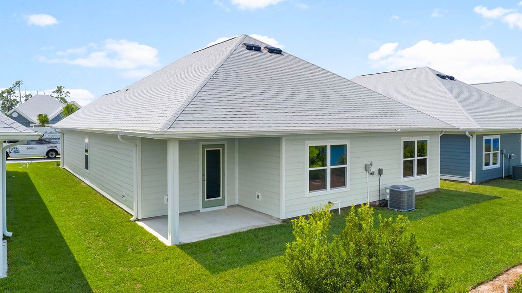 Front exterior of a new home in Windmark Beach, Port Saint Joe, FL, highlighting curb appeal (Image 16).