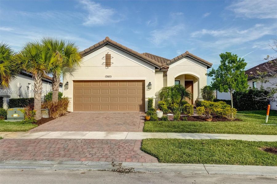 Front exterior of a new home in , Port St. Lucie, FL, highlighting curb appeal (Image 19). Front exterior of a new home in , Port St. Lucie, FL, highlighting curb appeal (Image 19).