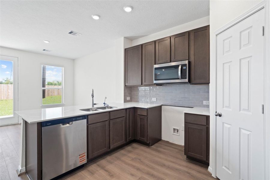 Additional view of kitchen.