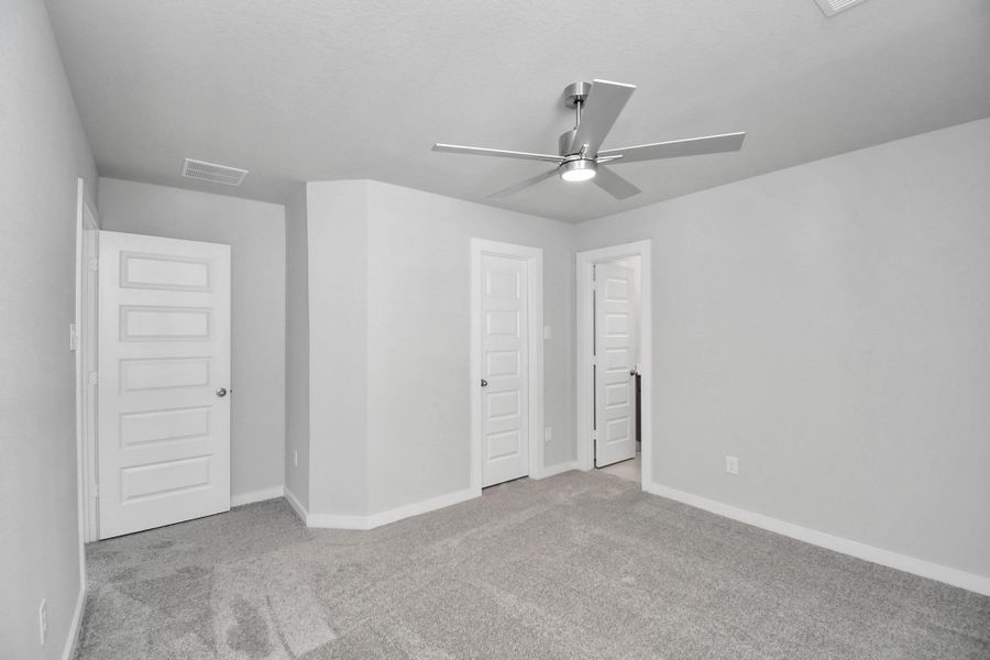 Generously sized secondary bedrooms featuring spacious closets, soft and inviting carpeting underfoot, large windows allowing plenty of natural light, and the added touch of privacy blinds for your personal retreat. Sample photo of completed home with similar floor plan. Actual colors and selections may vary.