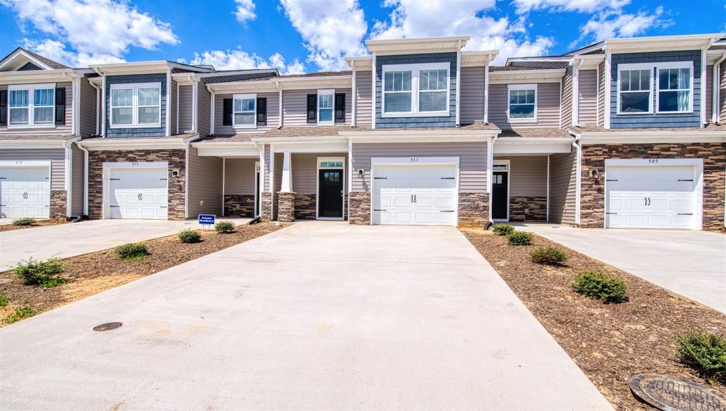 Representative exterior photo of a completed home built from the Denver by D.R. Horton in Townes at Tap Root Farms, Fletcher, NC (Image 2). Representative exterior photo of a completed home built from the Denver by D.R. Horton in Townes at Tap Root Farms, Fletcher, NC (Image 2).