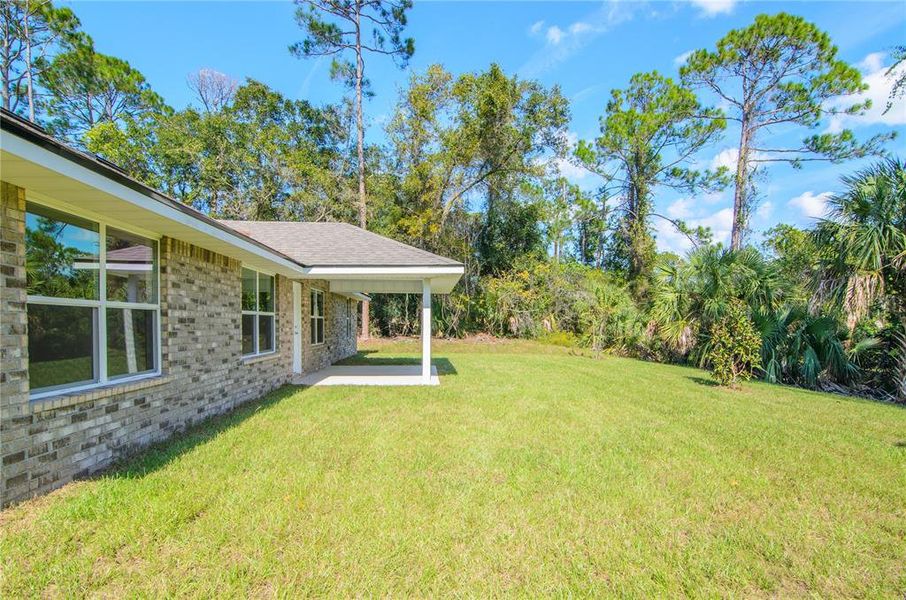 Exterior details and patio area of a home in Palm Coast, Palm Coast (Image 18).
