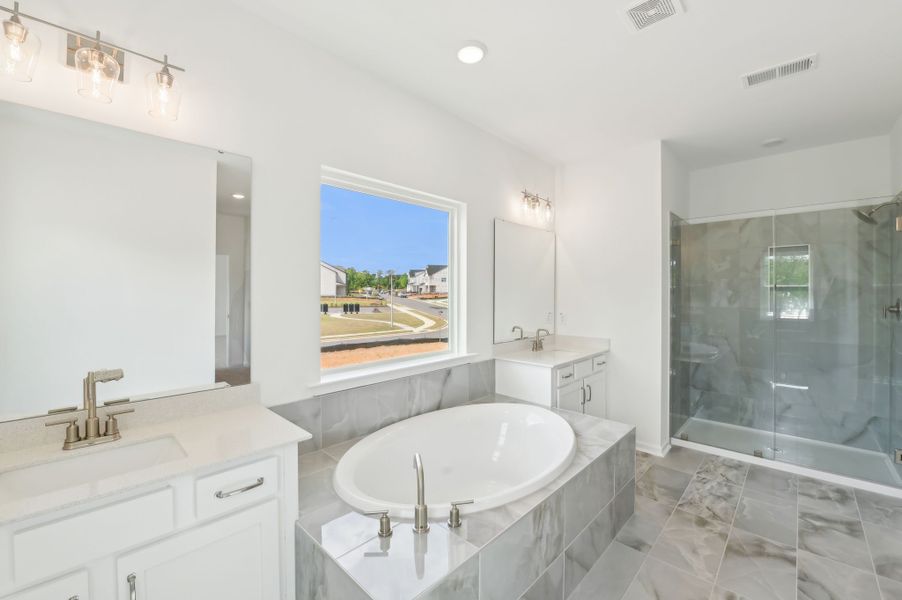 Representative furnished interior of a home built from the Alexis by Ashton Woods in Rowland's Grant, Fuquay Varina (Image 14).