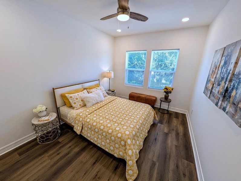 This 11' x 13' (approx.) space serves as a versatile guest room or a quiet executive home office.