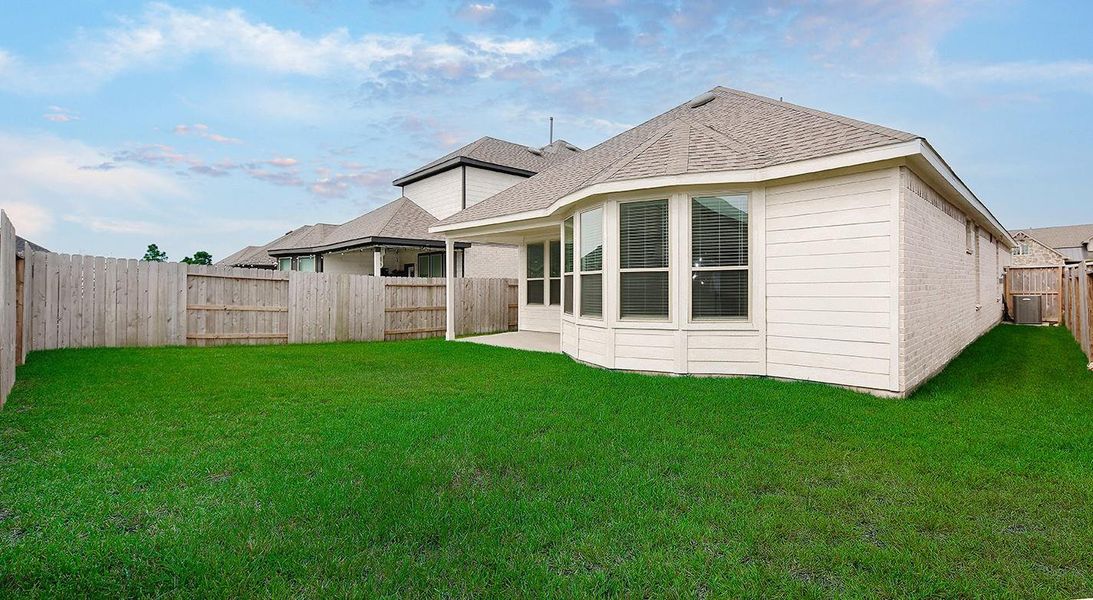 Front exterior of a new home in Mavera, Conroe, TX, highlighting curb appeal (Image 17).