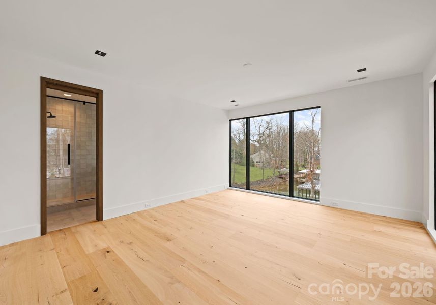 Guest suite with full bathroom and spacious walk-in closet. Guest suite with full bathroom and spacious walk-in closet.