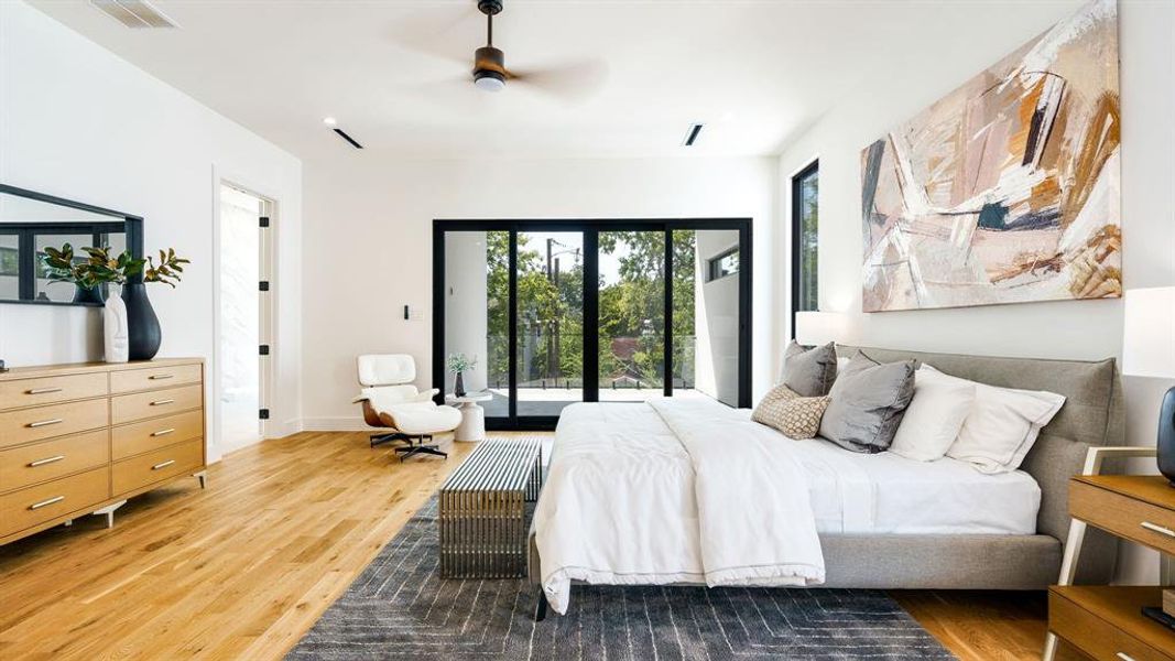 Bedroom featuring ceiling fan, hardwood / wood-style floors, and access to exterior