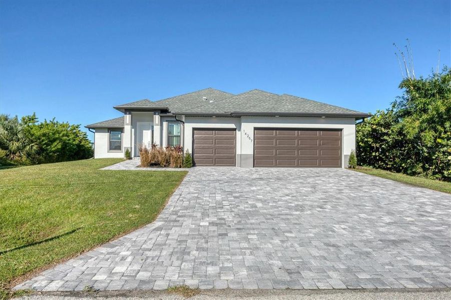 Front exterior of a new home in , Port Charlotte, FL, highlighting curb appeal (Image 24).