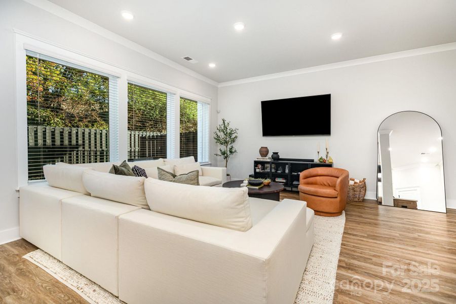 Large, open Great room has recessed lighting and LVP flooring throughout.