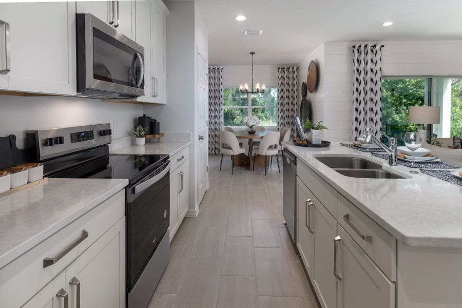 Furnished interior view inside a new home in Blue Springs Reserve Townhomes, Groveland (Image 6).