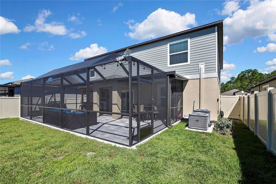 Exterior details and patio area of a home in Angeline: The Estates, Land O' Lakes (Image 29).