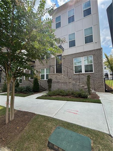 Front exterior of a new home in , Atlanta, GA, highlighting curb appeal (Image 1).