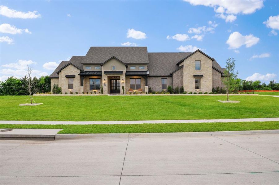 Front exterior of a new home in Chapel View, Heath, TX, highlighting curb appeal (Image 21). Front exterior of a new home in Chapel View, Heath, TX, highlighting curb appeal (Image 21).