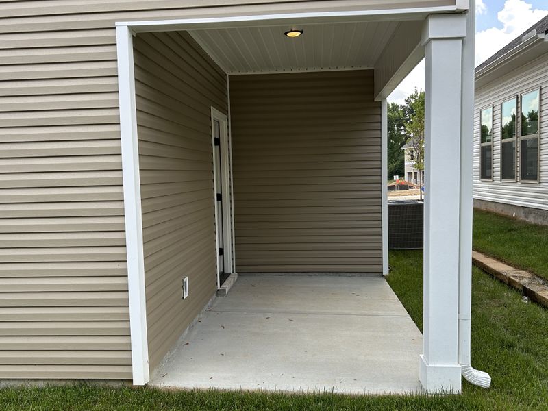Exterior details and patio area of a home in Hickory Cove, Burns (Image 3).