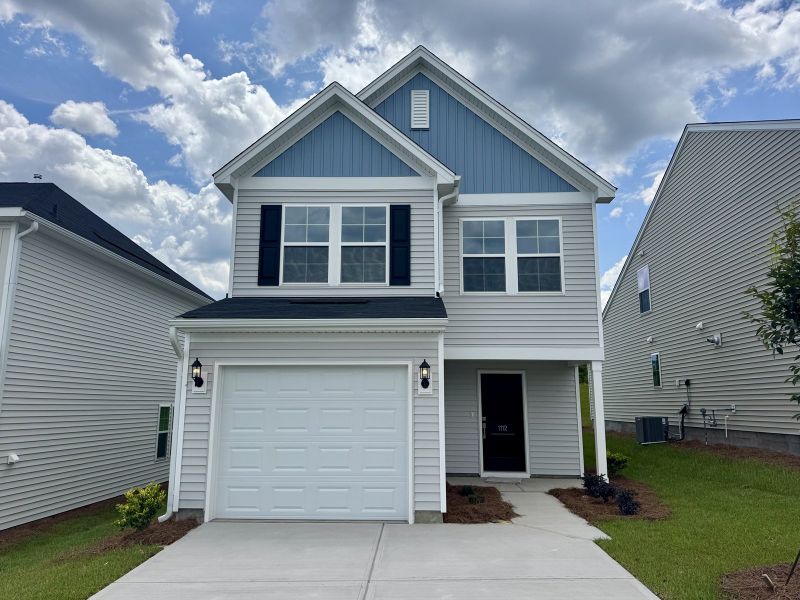 Front exterior of a new home in Ellington, Elgin, SC, highlighting curb appeal (Image 1). Front exterior of a new home in Ellington, Elgin, SC, highlighting curb appeal (Image 1).
