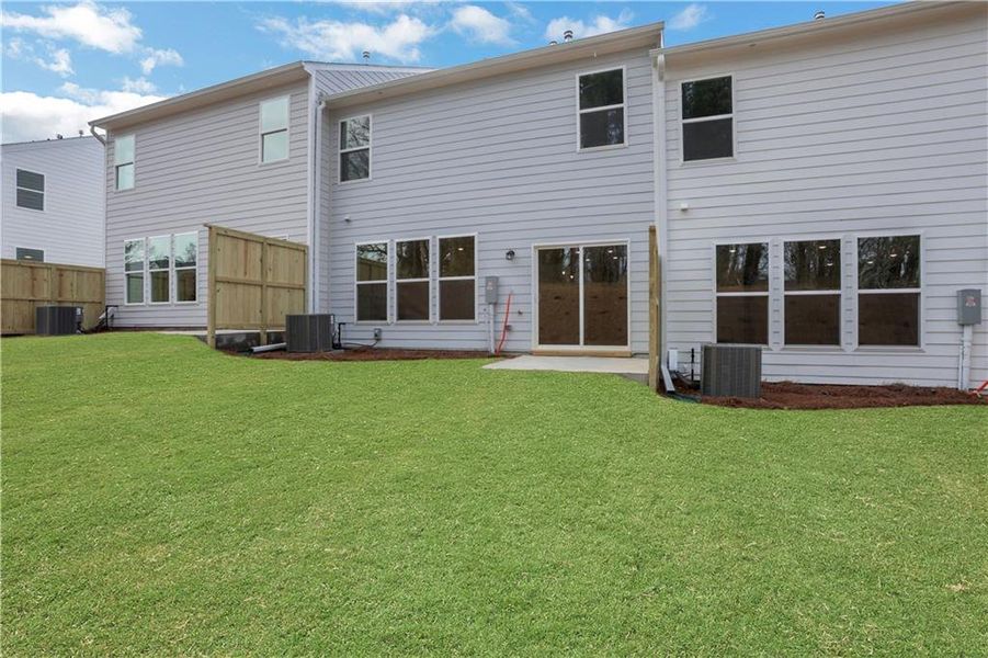 Exterior details and patio area of a home in Villas at Dawsonville Townhomes, Dawsonville (Image 21).