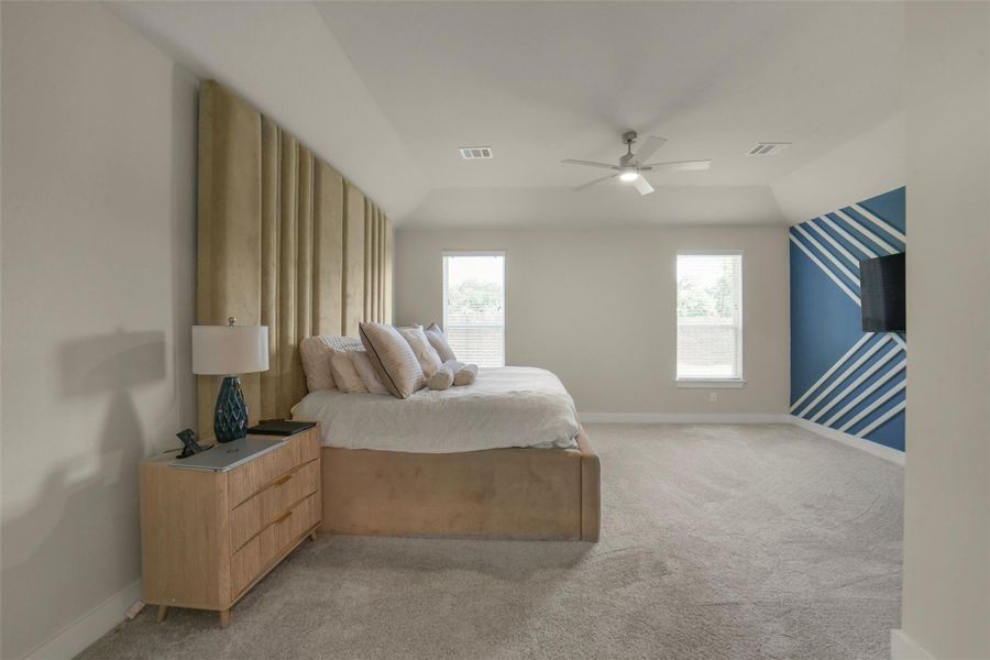 Spacious primary suite designed for relaxation.