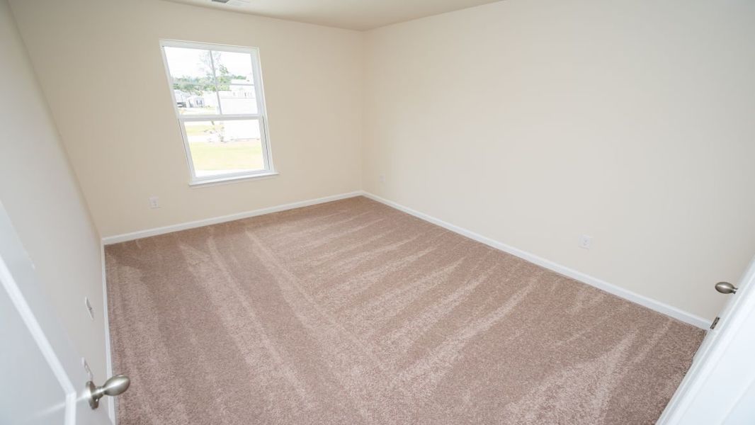 Spacious, unfurnished interior of a new home in The Pines at Blake Farm, Wilmington (Image 24).