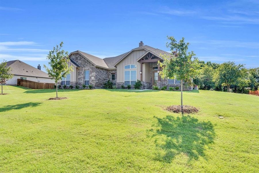 Front exterior of a new home in , Red Oak, TX, highlighting curb appeal (Image 23). Front exterior of a new home in , Red Oak, TX, highlighting curb appeal (Image 23).