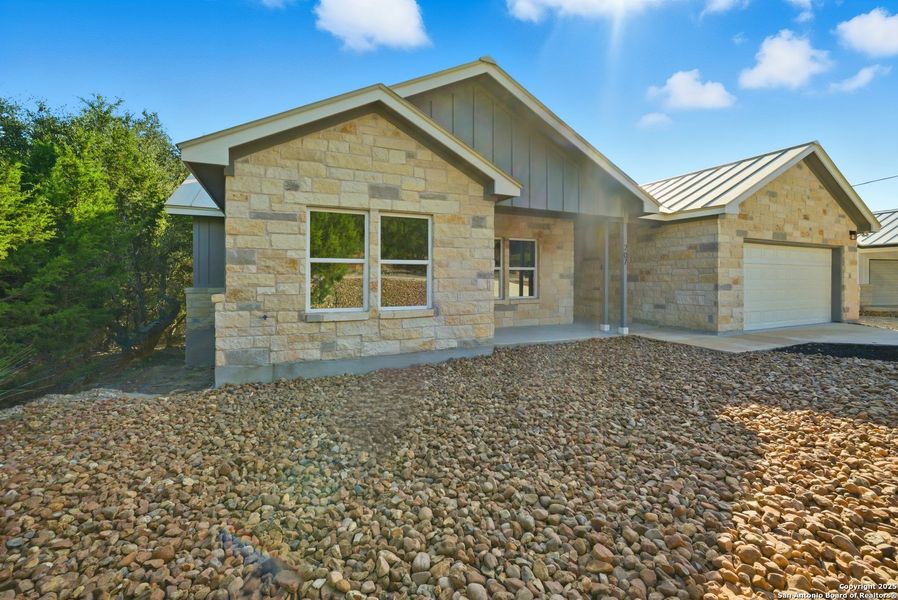 Front exterior of a new home in , Lakehills, TX, highlighting curb appeal (Image 24). Front exterior of a new home in , Lakehills, TX, highlighting curb appeal (Image 24).