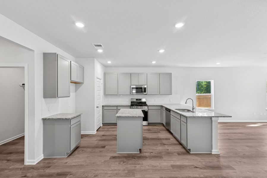 The Sparrow II- Kitchen with Island and Ample Cabinet Space The Sparrow II- Kitchen with Island and Ample Cabinet Space