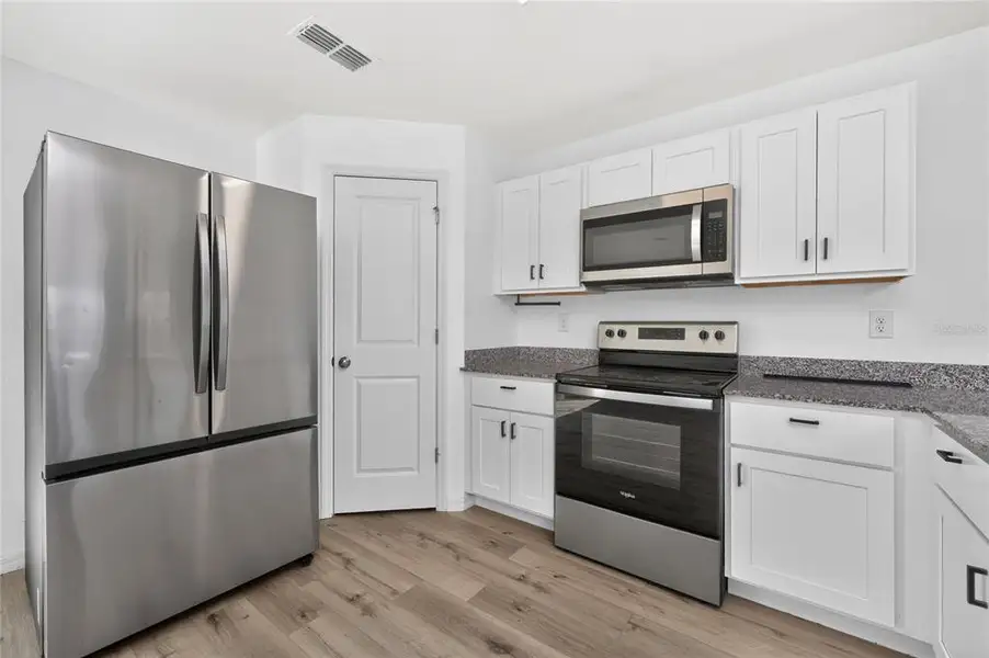 Furnished interior view inside a new home in , Port Charlotte (Image 19).