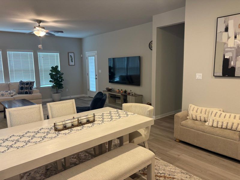 An inviting open-concept area connects the living and dining spaces, ideal for gatherings.